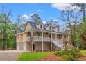 Charming home with a classic design, featuring a two-story porch and convenient garage access at 1533 Murrells Landing Rd., Conway, SC 29526