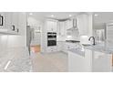 Modern kitchen featuring white cabinets, granite countertops, and stainless steel appliances at 1533 Murrells Landing Rd., Conway, SC 29526