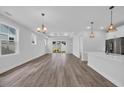 Open concept living area with recessed lighting and a sliding glass door that offers backyard views at 1549 Coastal Cove Ln, Calabash, NC 28467