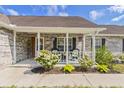 Inviting front porch with seating and decorative plants enhancing the home's curb appeal at 1566 Bessent Ave., Little River, SC 29566