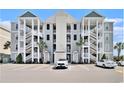 Attractive condo building with multiple floors, exterior staircases, and ample parking at 189 Ella Kinley Circle # 201, Myrtle Beach, SC 29588