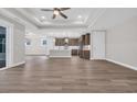 Spacious home with open floor plan and bright kitchen with island and stainless steel appliances at 1936 Indigo Cove Ln, Calabash, NC 28467