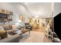 Open-concept living area with hardwood floors connects living, dining, and kitchen spaces at 2016 Willow Run Dr. # B, Little River, SC 29566