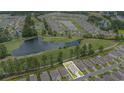 Aerial shot of a house near a pond and golf course in an idyllic neighborhood at 2059 Borgata Loop, Longs, SC 29568