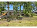 Inviting one-story brick home with covered parking and a neatly landscaped front yard at 2519 Reta St., Conway, SC 29526