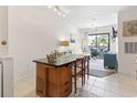 Open concept living area with dining area and natural light at 2710 South Ocean Blvd. # 208, Myrtle Beach, SC 29577
