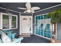 Inviting screened-in porch with ceiling fan, coastal decor, and comfortable seating at 299 Lake Arrowhead Rd., Myrtle Beach, SC 29572