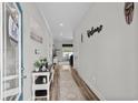 Inviting entryway featuring light, neutral walls and modern decor with a welcome sign at 322 Canyon Dr., Conway, SC 29526
