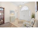 Welcoming foyer featuring tiled flooring, a decorative rug, high ceilings and plenty of room for furniture at 4 Stillwater Ct., Murrells Inlet, SC 29576