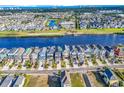 Breathtaking aerial view of a waterfront community with stunning water views, manicured landscaping, and community amenities at 437 Saint Julian Ln., Myrtle Beach, SC 29579