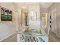 Elegant dining room featuring a glass-top table with seating for six, neutral paint and carpet at 4507 Sweetwater Blvd. # 4507, Murrells Inlet, SC 29576