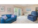 Cozy living room with comfortable seating, sliding glass doors to the balcony, and tasteful decor at 4507 Sweetwater Blvd. # 4507, Murrells Inlet, SC 29576