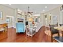Spacious living room featuring a fireplace, built-in shelving, and hardwood floors at 4803 Bucks Bluff Dr., North Myrtle Beach, SC 29582