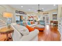 Bright, open living room with hardwood floors, comfortable seating, and ample natural light at 4803 Bucks Bluff Dr., North Myrtle Beach, SC 29582