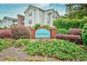 Community entrance sign for Bay Meadows surrounded by lush green foliage and colorful flowers at 4811 Innisbrook Ct. # 306, Myrtle Beach, SC 29579