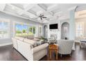 Bright living room features coffered ceilings, a fireplace, a ceiling fan, and a sliding glass door at 5032 Middleton View Dr., Myrtle Beach, SC 29579