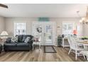 Bright living room features a cozy sofa, natural light, and stylish decor at 6001-1454 S Kings Hwy., Myrtle Beach, SC 29575