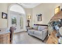 Cozy sitting area, featuring a loveseat, and glass doors that provide natural light at 603 Sea Island Way, North Myrtle Beach, SC 29582