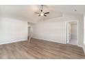 Spacious living room featuring hardwood floors, a ceiling fan, and neutral wall colors at 608 Woodside Dr., Conway, SC 29526