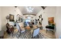 Spacious living room with high ceilings, stylish furniture, and unique decor creating an inviting atmosphere at 6205 Nixon St., North Myrtle Beach, SC 29582