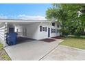 Charming exterior featuring a well maintained yard, covered parking and blue accents at 6304 Timberline Dr. # B, Myrtle Beach, SC 29572