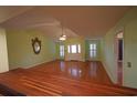 Open living room with hardwood floors, shutters, and neutral colors, creating a welcoming space at 669 George Washington Trail, Georgetown, SC 29440
