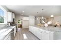 Spacious kitchen features large island with barstool seating, stainless steel appliances, and ample counter space at 740 Choctaw Dr., Conway, SC 29526