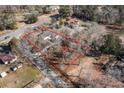Aerial view of the home with approximate boundaries marked on a wooded lot close to the road at 822 Highway 90, Conway, SC 29526