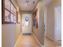 Well-lit hallway with hardwood floors, decorative trim, and art providing an elegant and welcoming entrance at 901 Southwind Ct., Garden City Beach, SC 29576