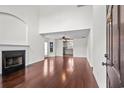 Spacious living room features gleaming hardwood floors, fireplace, and abundant natural light at 101 Barclay Dr., Myrtle Beach, SC 29579