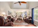 Spacious living room with vaulted ceilings, hardwood floors, and two comfortable sofas at 1053 Williston Loop # 1053, Murrells Inlet, SC 29576
