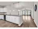 Open-concept kitchen featuring granite countertops, stainless steel appliances, and stylish pendant lighting at 1124 Valetto Loop, Myrtle Beach, SC 29579