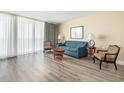 Bright and airy living room with elegant curtains and comfortable seating, perfect for relaxing at 201 S Ocean Blvd. # 1112, Myrtle Beach, SC 29577