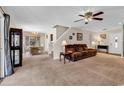 Open-concept living room with neutral carpet, and adjacent dining area leading to front door at 2017 Chadbury Ln., Myrtle Beach, SC 29588
