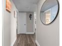 Inviting hallway with wood floors and neutral tones leads to various rooms, adding warmth to the interior at 202 74Th Ave. N # 2547/2548, Myrtle Beach, SC 29572