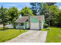 Charming home with a stone accent wall, a cozy front porch, and well-maintained landscaping at 202 Millstone Dr., Myrtle Beach, SC 29588