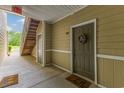 Hallway view featuring exterior door, staircase, and neutral color palette at 260 Woodlands Way # 2, Calabash, NC 28467