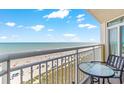 Balcony view overlooking the beautiful, sunny beach and clear ocean waters at 2701 S Ocean Blvd. # 902, North Myrtle Beach, SC 29582