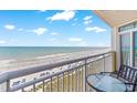 Balcony view overlooking the beautiful, sunny beach and clear ocean waters at 2701 S Ocean Blvd. # 902, North Myrtle Beach, SC 29582