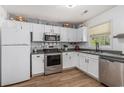 A well-organized kitchen featuring white cabinetry, stainless steel appliances, and modern fixtures at 271 Sienna Dr., Little River, SC 29566
