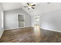 Bright living room with high ceilings, ceiling fan, wood floors, and built-in shelving at 2712 Austin Ave., Conway, SC 29527