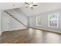 Spacious living room with a vaulted ceiling, staircase, wood floors, and natural light at 2712 Austin Ave., Conway, SC 29527