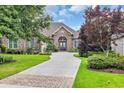 Attractive brick home with lush landscaping, long drive and a double-door entry at 290 Dornoch Dr., Pawleys Island, SC 29585