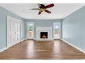 Living room featuring a fireplace flanked by two doors leading to a deck at 3001 Wiley Dr., North Myrtle Beach, SC 29582