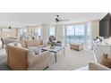 Inviting living room with ocean views, neutral decor, and comfortable seating arrangement at 3805 S Ocean Blvd. # 503, North Myrtle Beach, SC 29582