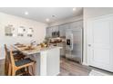 Bright kitchen featuring stainless steel appliances, granite countertops, and eat-in island at 406 Acosta Circle, Conway, SC 29527