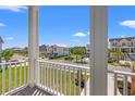 Beautiful neighborhood view from the porch of a lovely beach house with blue skies at 434 Harbour View Dr., Myrtle Beach, SC 29579