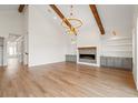 Bright, open living room featuring wood floors, a fireplace, and neutral paint at 434 Harbour View Dr., Myrtle Beach, SC 29579
