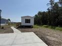 Inviting single-level home with new concrete walkway and plenty of room for parking at 500 King Air Ct, Myrtle Beach, SC 29577