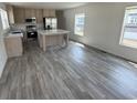 Bright kitchen with a center island, stainless steel appliances, and durable flooring at 516 King Air Ct, Myrtle Beach, SC 29577
